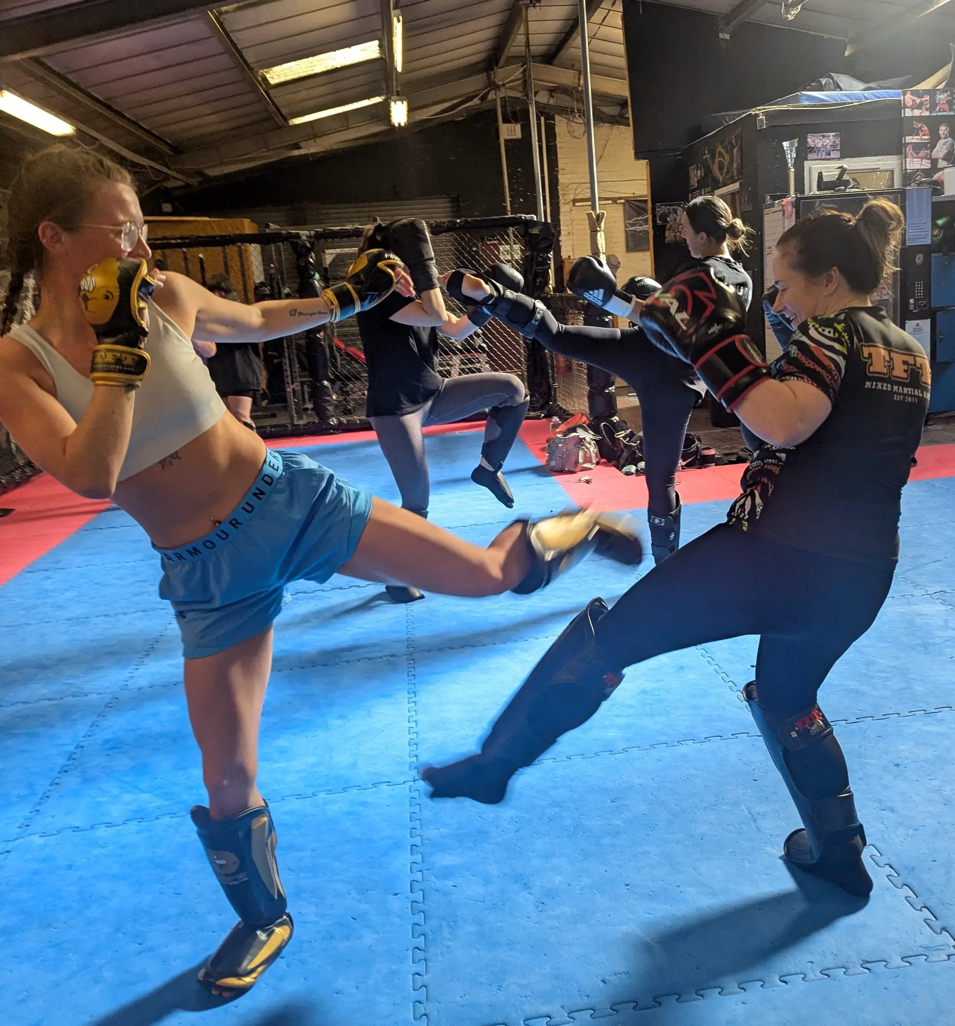 Women training kickboxing together at TFT MMA